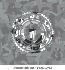 robot icon inside grey camouflaged emblem