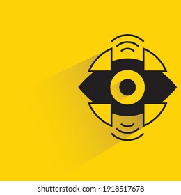 robotic eye with shadow on yellow background
