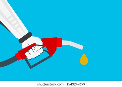 robotic hand holding gasoline nozzle with fuel drop