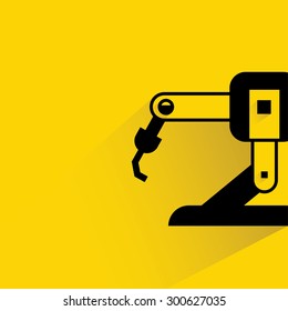 robotic hand icon  on yellow background, flat and shadow theme