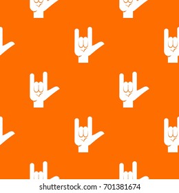 Rock gesture pattern repeat seamless in orange color for any design. Vector geometric illustration