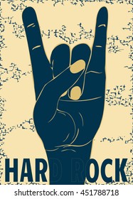 Rock hand gesture on yellow background