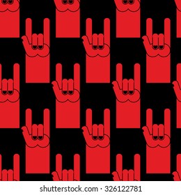 Rock hand sign red seamless pattern. Background of  symbol of rock and roll.
