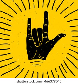 Rock hand sign silhouette with rays. Vector logo / label / tattoo