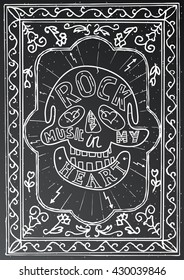 Rock music in my heart. Hand drawn lettering design with skull and frame on black chalk board. Typography concept for t-shirt design or web site. Vector illustration.