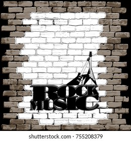 Rock music volume inscription on an old brick wall with electric rock guitars. 