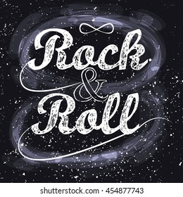 Rock n roll, infinity sign, grunge background, written in chalk on a dark background