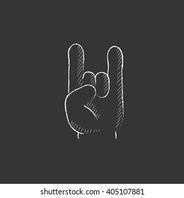 Rock and roll hand sign. Drawn in chalk icon.