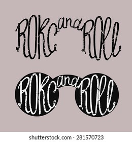 Rock and roll, ink hand lettering.Inspiration hand drawn quote. On a white background.