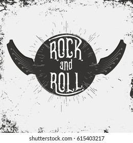 Rock and Roll music print. Grunge print for T-shirt with lettering and wings in guitar form. Monochrome vintage label, stamp with starburst and ray. Vector illustration