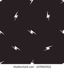 Rock and roll seamless pattern with electricity lightnings. Vector hard rock doodle illustration. Cartoon rock star iconic backdrop for music band, concert, party. Isolated on black background.