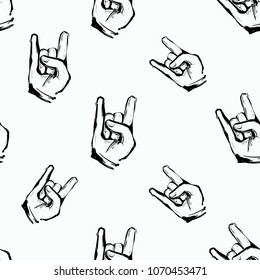 Rock and roll seamless pattern with rock gesture. Vector hard rock doodle illustration. Cartoon rock star iconic backdrop for music band, concert, party. Isolated on black background.