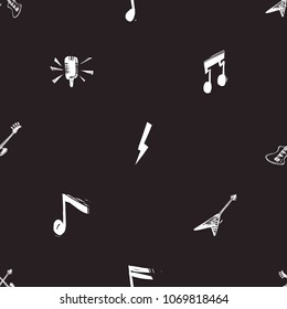 Rock and roll seamless pattern with rock solo guitar, bass guitars, flash lightnings, note signs, microphone. Cartoon rock star iconic backdrop for music band, party. Isolated on black background.