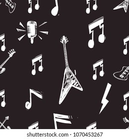 Rock and roll seamless pattern with rock solo guitar, bass guitars, flash lightnings, note signs, microphone. Cartoon rock star iconic backdrop for music band, party. Isolated on black background.