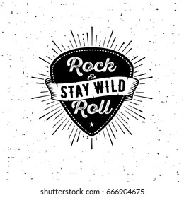 Rock and Roll sign. Stay wild. Slogan graphic for t shirt. Poster with plectrum, ribbon, starburst.
