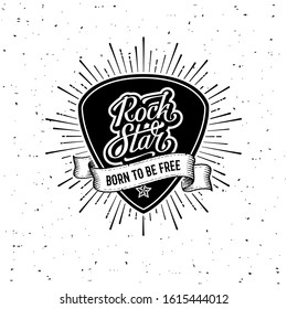 Rock star handwritten lettering on a plectrum. Born to be free Slogan graphic for t shirt or tattoo. Poster with plectrum, starburst, ribbon. Vector illustration