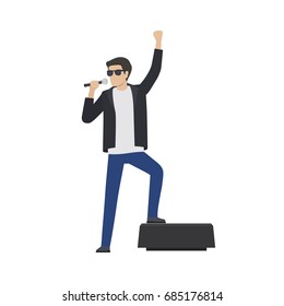 Rock star in sunglasses and leather jacket sing in microphone with raised hand and leg on speaker isolated vector illustration on white background.