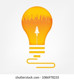 Rocket and city in light bulb. Business start up concept.vector art and illustration.