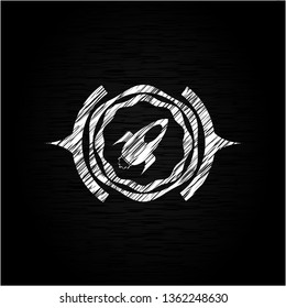 rocket icon drawn on a blackboard