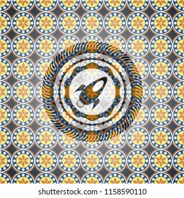 rocket icon inside arabic badge. Arabesque decoration.