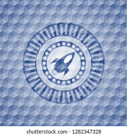 rocket icon inside blue badge with geometric pattern.