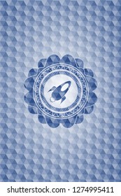 rocket icon inside blue emblem with geometric pattern.