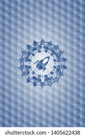 rocket icon inside blue hexagon badge.