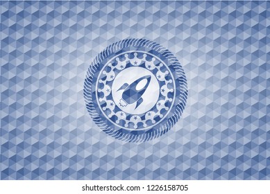 rocket icon inside blue polygonal badge.
