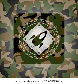 rocket icon inside camouflage emblem