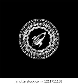 rocket icon inside chalkboard emblem