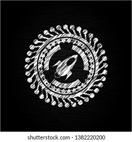 rocket icon inside chalkboard emblem written on a blackboard