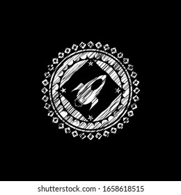rocket icon inside chalkboard emblem written on a blackboard