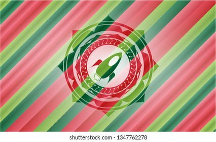 rocket icon inside christmas badge.