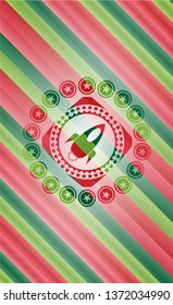 rocket icon inside christmas badge.