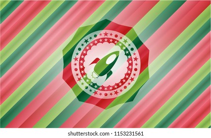rocket icon inside christmas emblem.