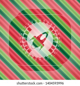 rocket icon inside christmas emblem.