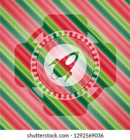 rocket icon inside christmas style emblem.