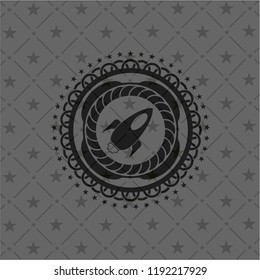 rocket icon inside dark badge or emblem