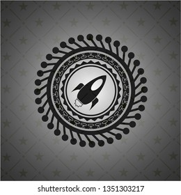 rocket icon inside dark badge