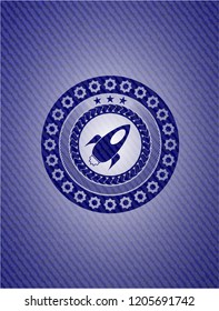 rocket icon inside emblem with jean texture