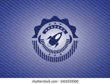 rocket icon inside emblem with jean texture