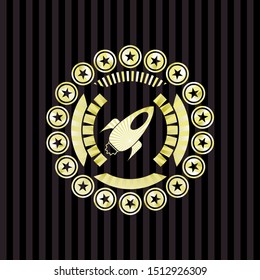 rocket icon inside gold emblem