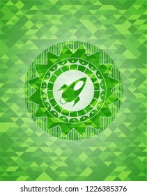 rocket icon inside green emblem. Mosaic background