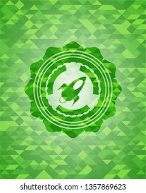 rocket icon inside green emblem. Mosaic background