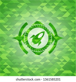 rocket icon inside green emblem with triangle mosaic background