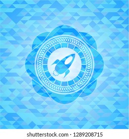rocket icon inside light blue emblem. Mosaic background
