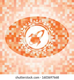 rocket icon inside orange mosaic emblem