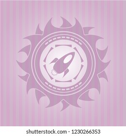 rocket icon inside pink emblem