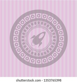 rocket icon inside pink icon or emblem