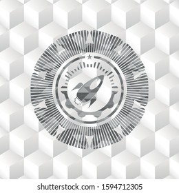 rocket icon inside realistic grey emblem with geometric cube white background